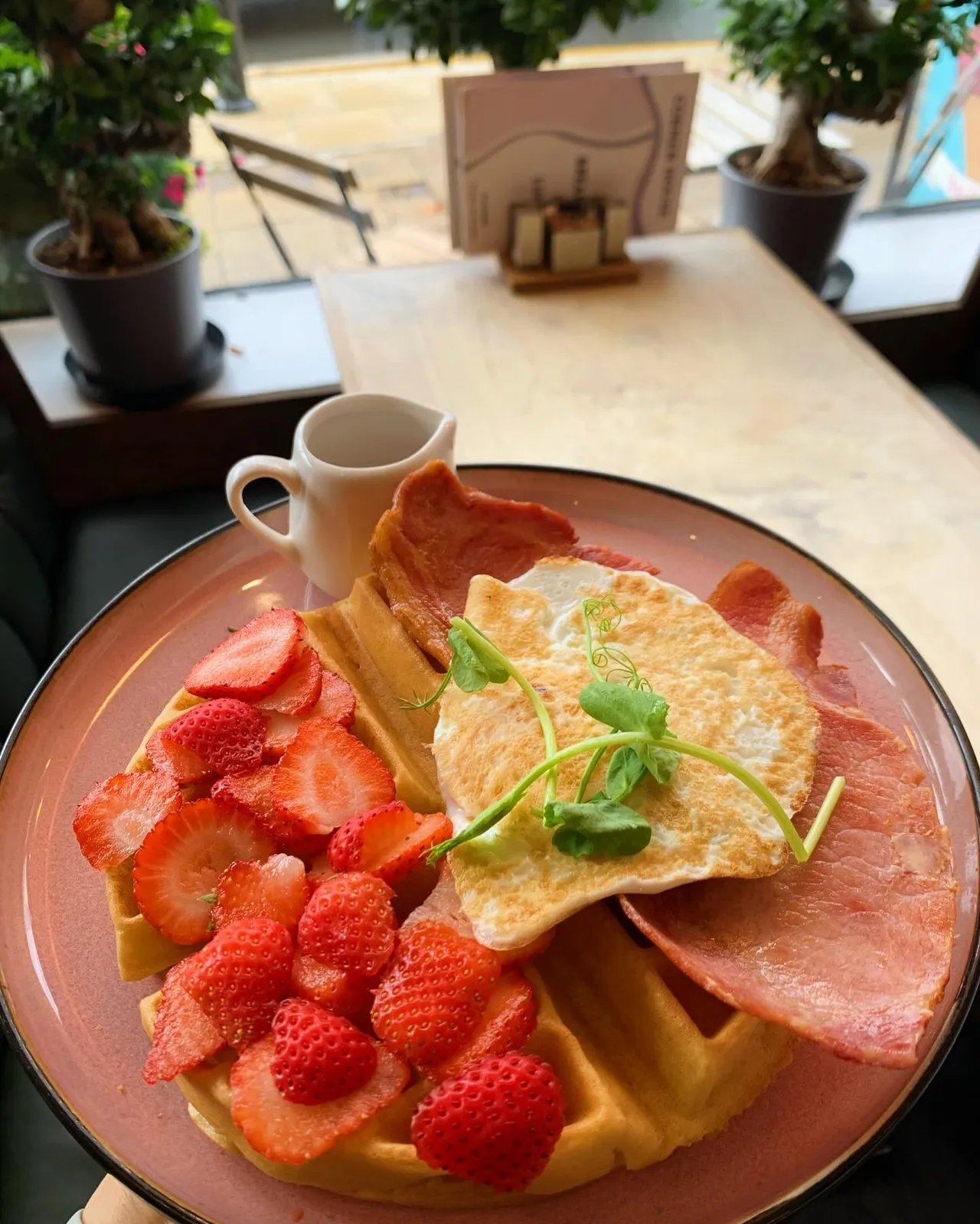 A freshly prepared breakfast at a window table in Corner House