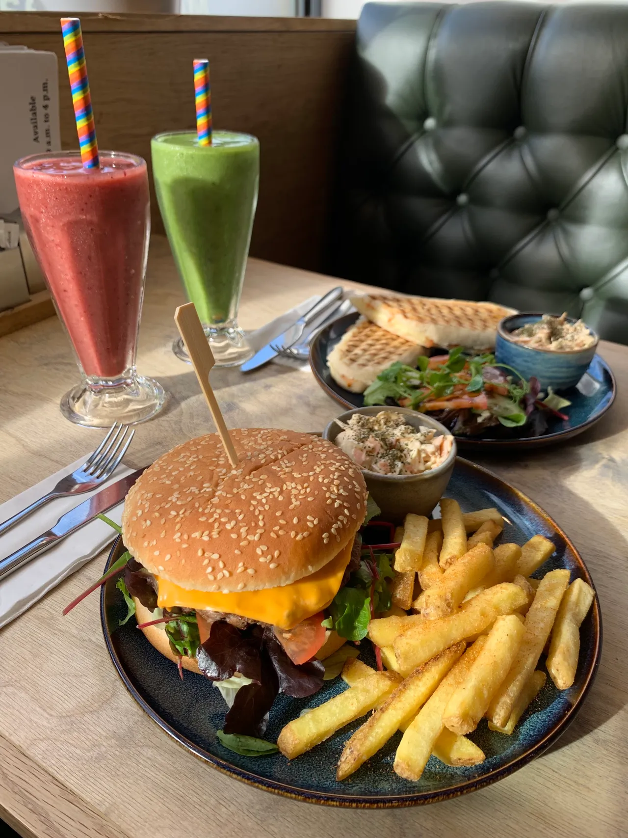 Lunch and colourful drinks served at a Corner House table