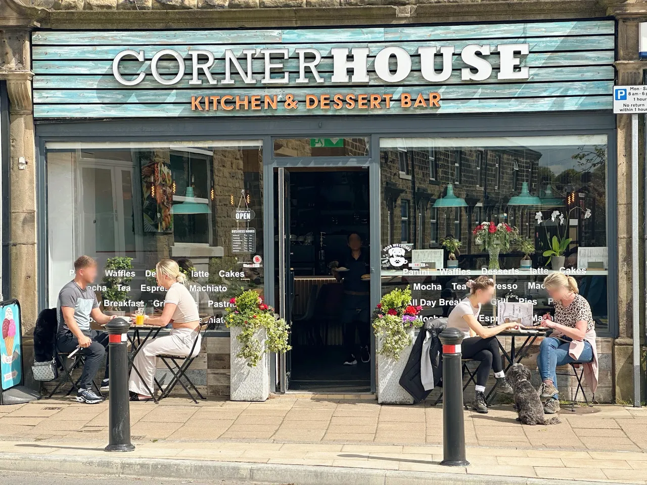 Corner House Kitchen & Dessert Bar on Otley Road, with its turquoise sign and outdoor tables